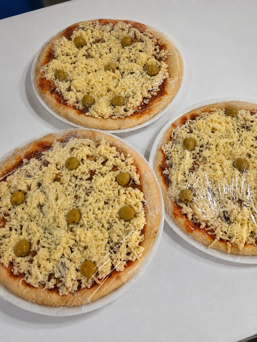 Pizzas Muzzarella con aceitunas